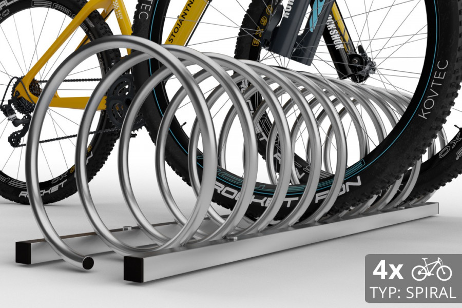 Cyklo stojan na 4 bicykle špirálovitého tvaru. Povrchová úprava galvanický pozink.
